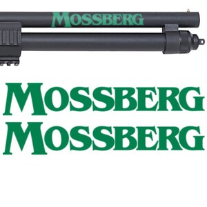 May include: A black shotgun with a green "Mossberg" logo on the barrel. The logo is repeated twice below the image of the shotgun.