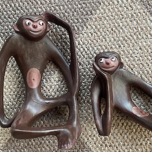 Mid Century Modernist Arnel’s custom painted monkey pottery sculptures