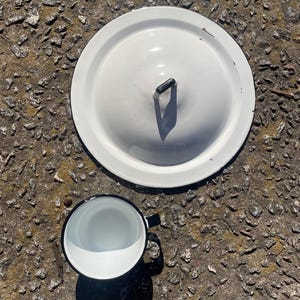 Vintage white and black enamel lid and cup