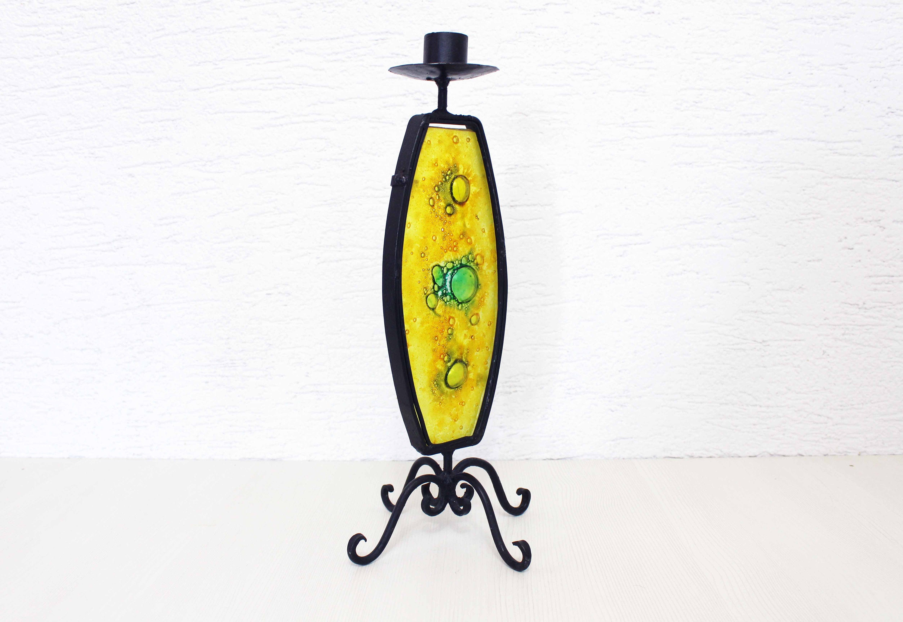Beautiful wrought iron candle holder with stained glass. Beautiful wrought iron candle holder with stained glass.