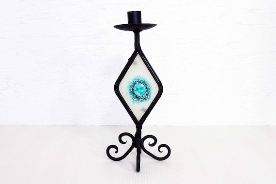 Beautiful wrought iron candle holder with stained glass. Beautiful wrought iron candle holder with stained glass.