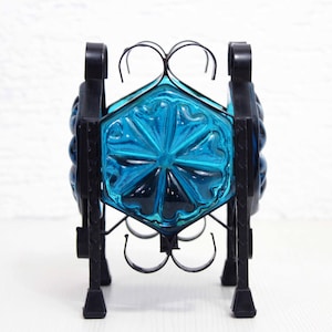 Beautiful candlestick in iron and blue glass