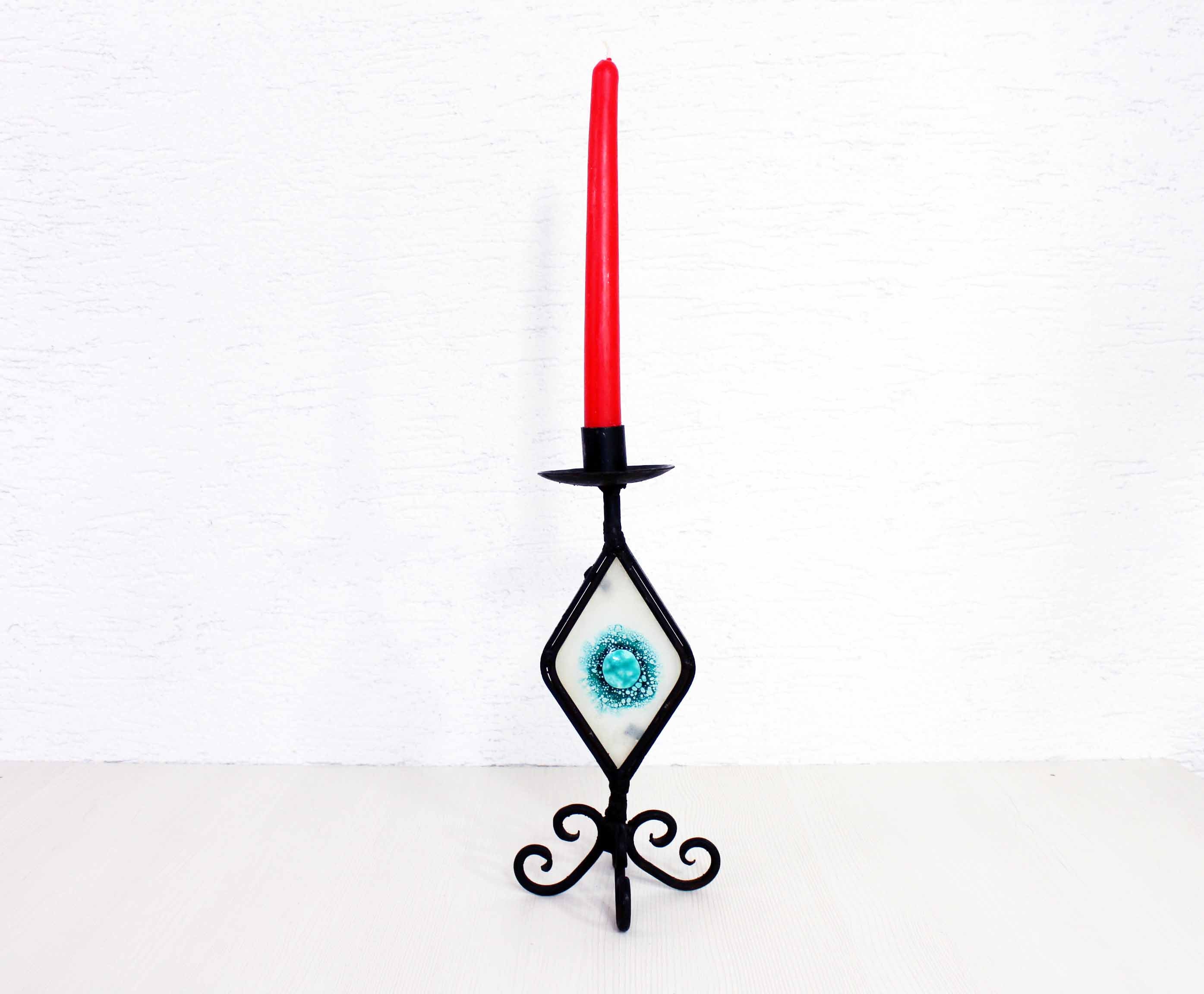 Beautiful wrought iron candle holder with stained glass. Beautiful wrought iron candle holder with stained glass.