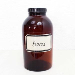 May include: A brown glass jar with a black lid and a white label that says "Borax".