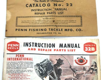 May include: Two vintage Penn Reels instruction manuals and repair parts lists. The top catalog is Catalog No. 22, and the bottom one is Catalog 32B. The bottom manual features an illustration of a fishing reel and fishermen.