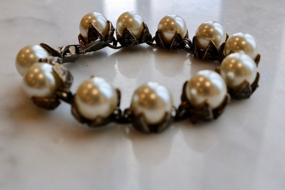 Large faux pearl bracelet with ornate links setti… - image 1