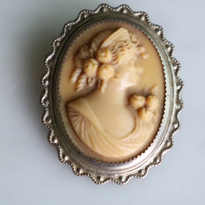 Vintage Embossed Celluloid cameo pin brooch with silver plate frame