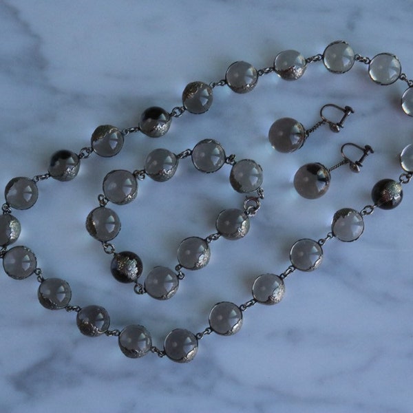 Exquisite ornate sterling mounted undrilled Pools of Light necklace bracelet and earrings circa 1910