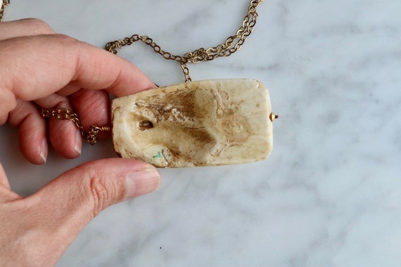 Massive bone pendant on long chain - image 5