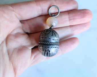 Antique Chinese puffy pendant with Carnelian bead
