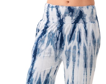 May include: Blue and white tie-dye pants with a loose, flowing fit. The pants have a wide waistband and a relaxed, comfortable look.