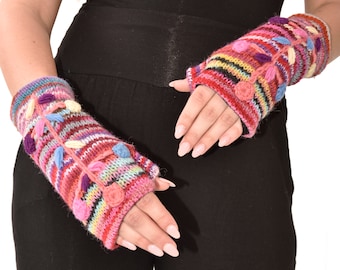 May include: A pair of colourful fingerless gloves with a striped pattern and floral embroidery. The gloves are made of a soft, knitted fabric and have pom-poms on the cuffs.