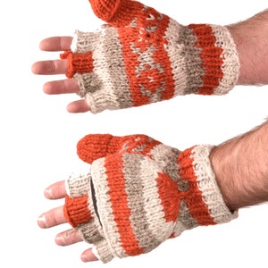 May include: A pair of fingerless gloves with a striped pattern in orange and beige. The gloves are made of knitted wool.