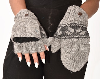 May include: A pair of gray fingerless gloves with a black cuff and a gray and black patterned design. The gloves have a button on the top of each hand.