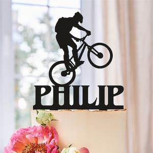 060b Acrylic or Baltic Birch Special Event Cake Topper Mountain Biker With Ponytail