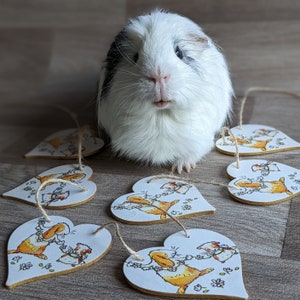 Guirnalda de madera con forma de corazón de conejo y cobaya (cadena de margaritas)