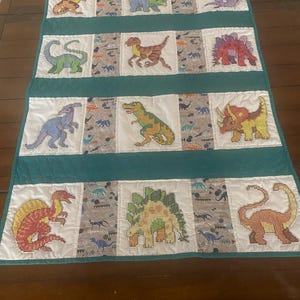 Dinosaur baby quilt hand embroidered