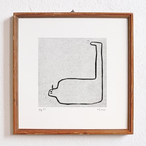 May include: A framed black and white line drawing of a stylized figure with a long neck and a rounded body. The drawing is on a textured paper background. The frame is made of wood and has a light brown finish. The drawing is signed "PK 22" and numbered "1/400".