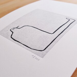 May include: Black and white line drawing of a simple abstract shape on a white background. The drawing is titled "PK-11" and numbered "1/100".