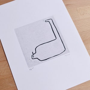 May include: A black and white line drawing of a stylized animal with a long neck and a small head. The drawing is on a textured, light gray background. The text "PK 22" and "1/100" are printed in the bottom right corner of the image.
