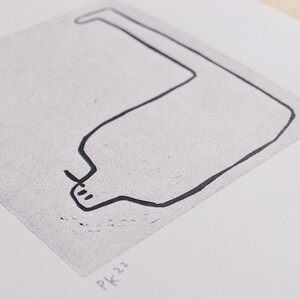 May include: A black and white line drawing of a bottle with a long neck and a rounded body. The drawing is on a white background with the text "PK 22" in the bottom left corner.