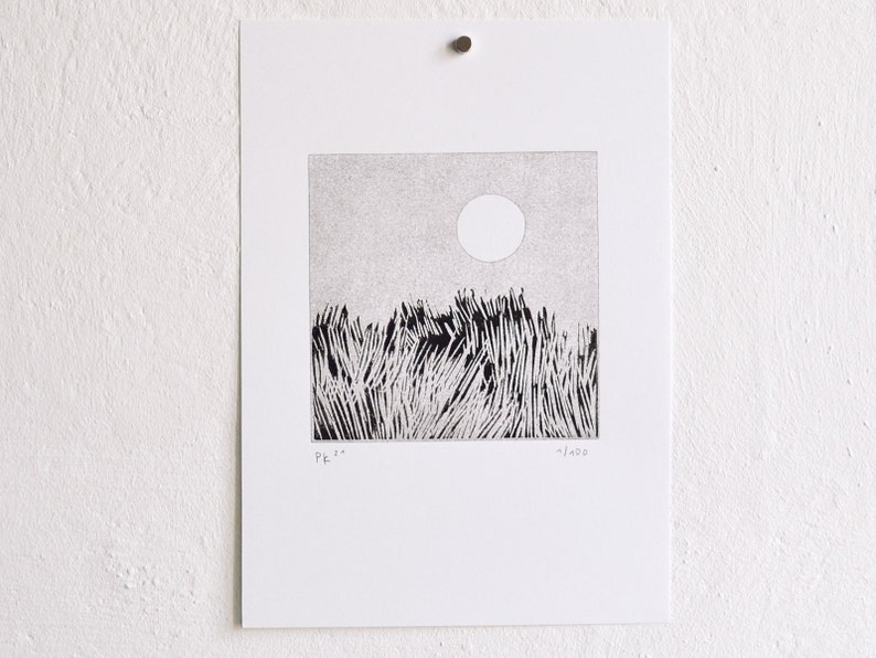 May include: A black and white square art print on white paper featuring a stippled sky with a circular sun above a field of tall, dense grass. The print includes the handwritten text "PK 21" on the bottom left and "11/100" on the bottom right.