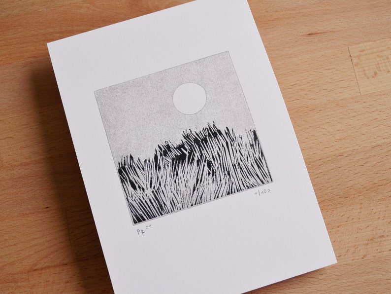 May include: A square black and white ink drawing on white paper featuring a field of tall grass under a circular sun. The artwork includes the handwritten text Pk '20 in the bottom left corner and the edition number 1/100 in the bottom right corner.