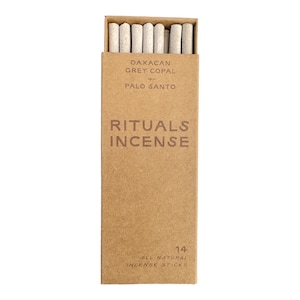 May include: A box of 14 all-natural incense sticks. The box is brown and has the text "Oaxacan Grey Copal Palo Santo Rituals Incense" printed on it.