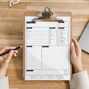 May include: A white clipboard with a black checklist and a project name section. The clipboard is on a wooden surface with a laptop and a pair of earbuds.