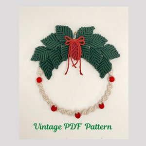 May include: A green macrame wreath with a red bow and red beads. The wreath is on a white background. Vintage PDF Pattern.