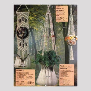 May include: Three macrame plant hangers with different lengths and designs. The hangers are made with beige and brown cord and feature metal rings and beads. The hangers are shown hanging in a wooded area.
