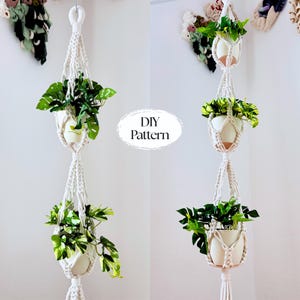 May include: A macrame plant hanger with three white ceramic pots filled with green plants. The off-white rope is knotted in a decorative pattern. The text "DIY Pattern" is in the center of the image.