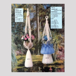 May include: Two macrame plant hangers, one white and one blue, with instructions for making them. The white hanger is 36 inches long and the blue hanger is 42 inches long, including the fringe. The instructions include the materials needed and the cut lengths of cord.