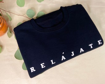 Relájate sweatshirt latina empowerment new years black crewneck sweater, latina owned handmade latina sweater, mental health latina sweater