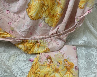 Vintage Disney Princess enchanted tales twin 2 pieces sheet set , belle Cinderella, Aurora wearing yellow golden dresses, flat fitted sheet