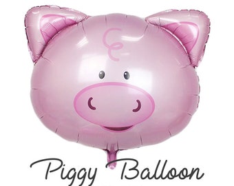 Könnte beinhalten: Rosafarbener Schweinekopf-Folienballon mit weißer Schnauze und Augen. Der Ballon trägt den Schriftzug "Piggy Balloon Oink Oink" und das Logo "Cheers Balloons".