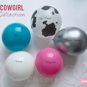 May include: A selection of colourful balloons, including teal, white, magenta, and silver chrome. One balloon has a cow print design. The text "COWGIRL Collection" is displayed at the top.