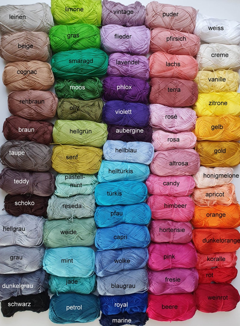 May include: A collection of colorful yarn skeins in various shades, including green, purple, pink, and blue. Each skein is labeled with its color name, such as "limone," "lavender," and "pink." The yarn is arranged in neat rows, showcasing a wide range of hues.