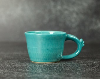 Ceramic espresso, tea, or coffee cup in turquoise blue