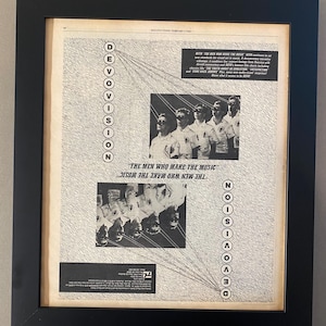 May include: A black and white magazine advertisement for the band Devo. The ad features a photo of the band members in their signature red energy dome helmets. The text reads "The men who make the music... the music the wave who make the music."  The ad also includes the band's name "Devo" in large letters.