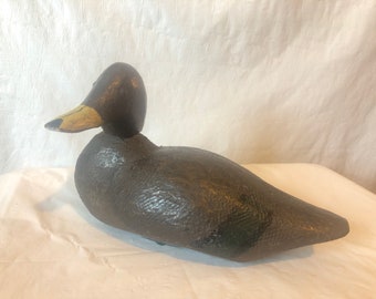 Antique life sized wood carved duck; swivel and removable head with mail eyes