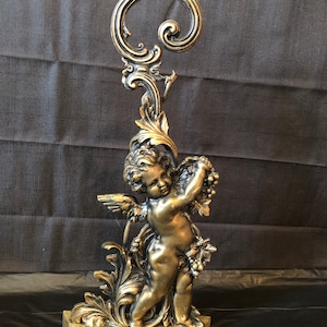 Antique English Peerage cherub angel tall door stop in brass and cast iron marked on bottom