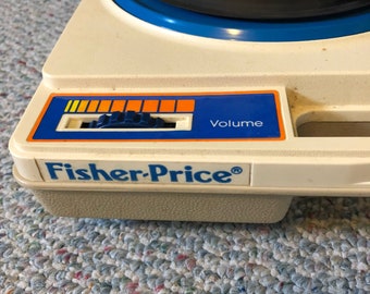 fisher price 1978 working record player. model #825 with one record.