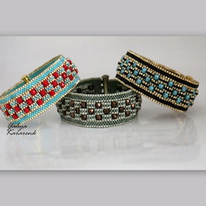 May include: Three beaded bracelets with different coloured beads and patterns. The bracelets are stacked on top of each other. The top bracelet is black with turquoise beads, the middle bracelet is grey with brown beads, and the bottom bracelet is turquoise with red beads.