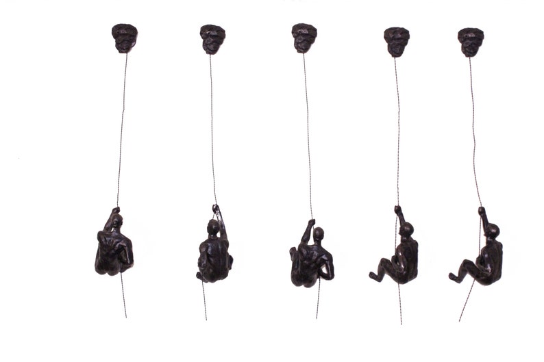 bronze abseiling figures