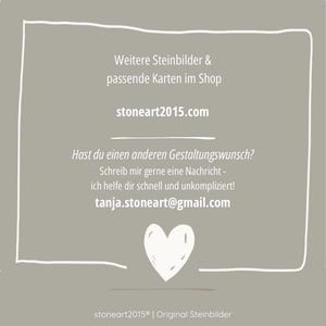 May include: A gray card with white text and a white heart illustration. The text includes a website address, an email address, and phrases in German. The card is framed with a white border.