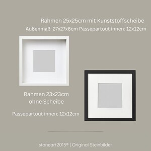 May include: A white square frame with a plastic pane measuring 25x25cm, outer dimensions 27x27x6cm, and a 12x12cm mat. A black square frame measuring 23x23cm without a pane, featuring a 12x12cm mat. Text reads: stoneart2015 Original Steinbilder.
