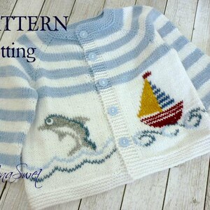 May include: Knitting pattern for a white and blue striped baby cardigan with a sailboat and dolphin design. The pattern includes instructions for knitting the cardigan and the embroidered details.