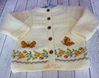 Hand knit baby cardigan with Floral Border