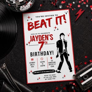May include: A birthday party invitation with a red border and the words "BEAT IT!" in bold red letters. The invitation features a silhouette of a dancer and party details. A cassette tape and vinyl record are in the background.